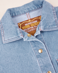 Indigo Denim Work Jacket in Light Wash collar and brass button close up