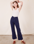Alex is 5'8" and wearing XS Western Pants in Navy Blue paired with vintage off-white Tank Top