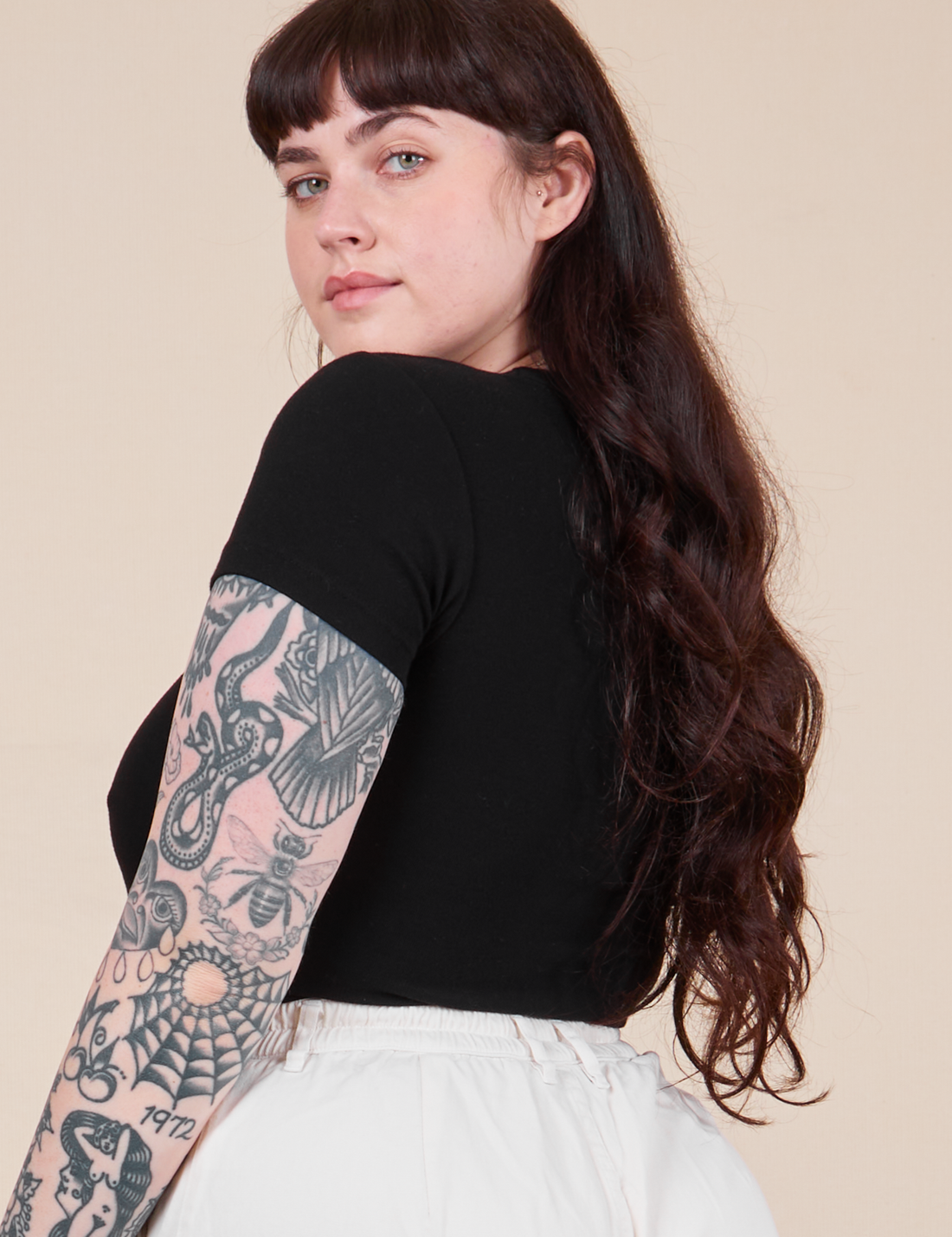 Angled back view of Baby Tee in Basic Black on Sydney