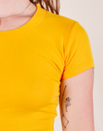 Front close up of Baby Tee in Sunshine Yellow on Alex