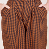Front close up of Checker Trousers in Brown worn by Alex
