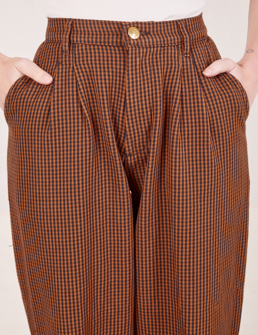 Front close up of Checker Trousers in Brown worn by Alex