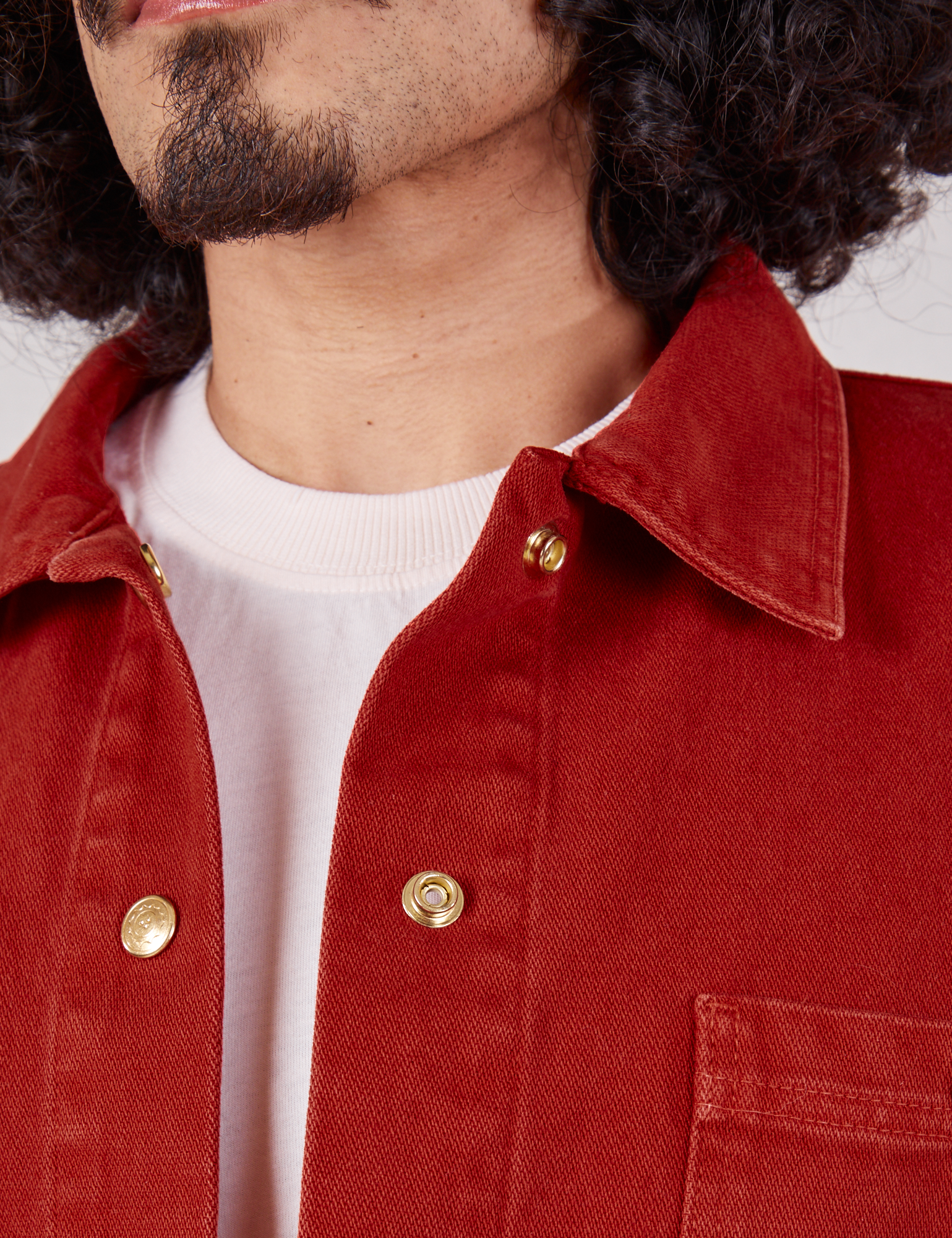 Denim Work Jacket in Paprika collar and brass snaps close up on Jesse