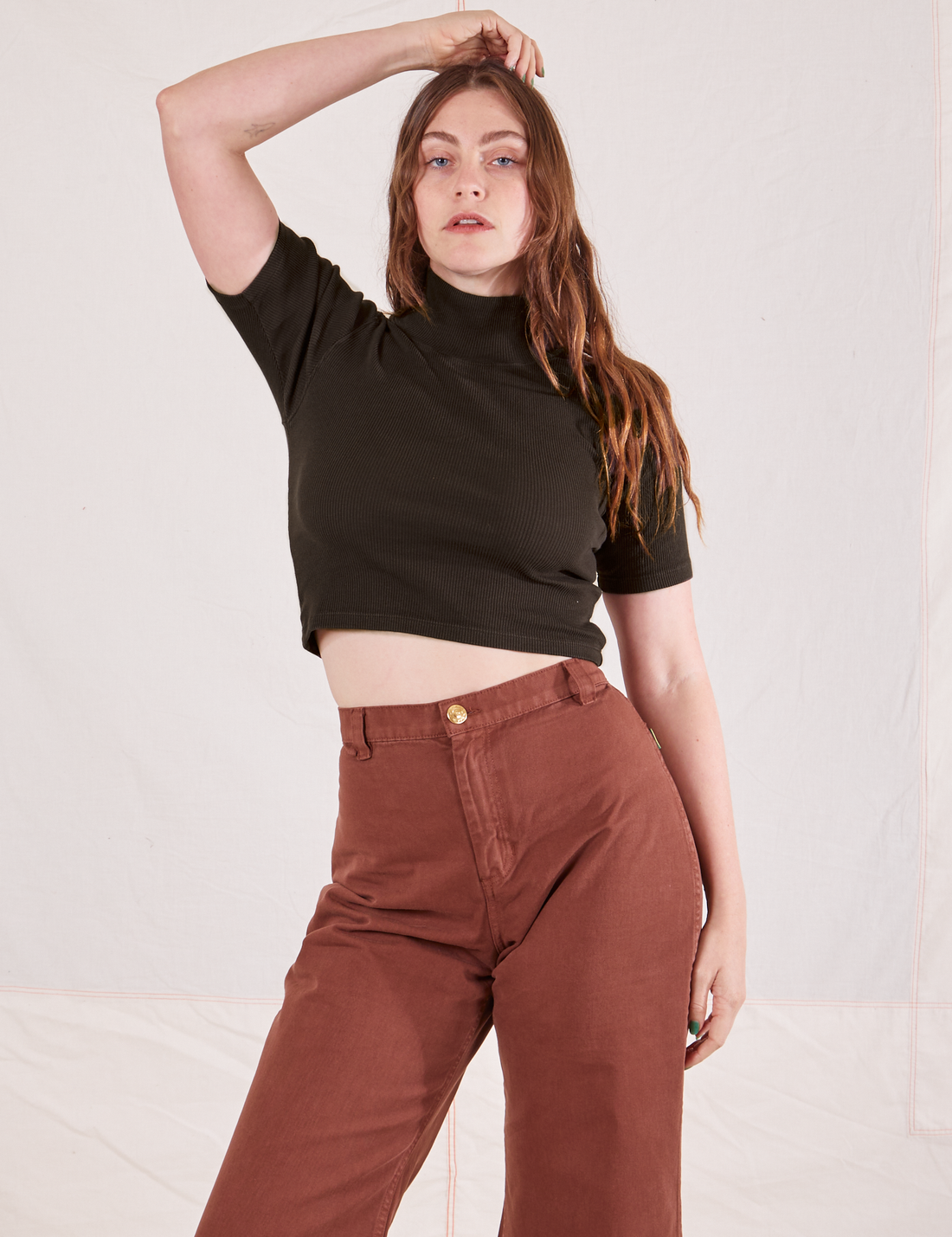 Allison is wearing 1/2 Sleeve Essential Turtleneck in Espresso Brown and fudgesicle brown Bell Bottoms