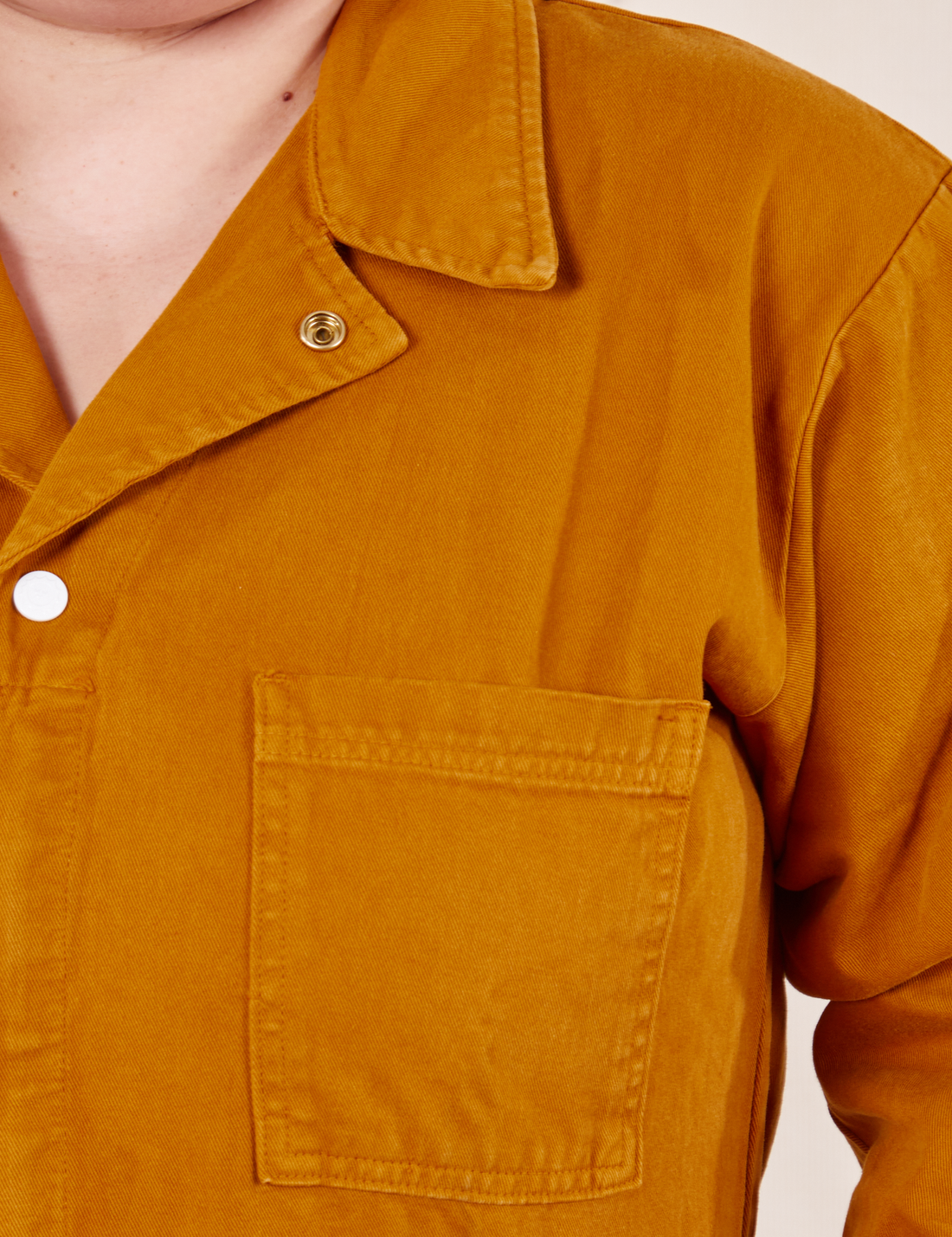 Front close up of Everyday Jumpsuit in Spicy Mustard worn by Ashley