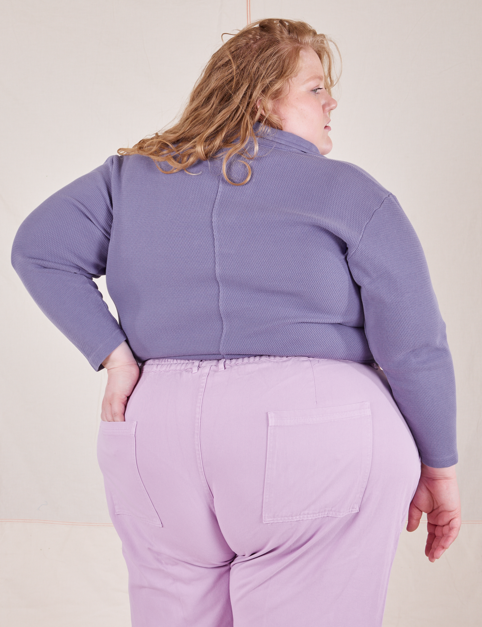 Back view of Long Sleeve Fisherman Polo in Faded Grape worn by Catie