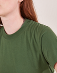 The Organic Vintage Tee in Dark Emerald Green close up on Alex