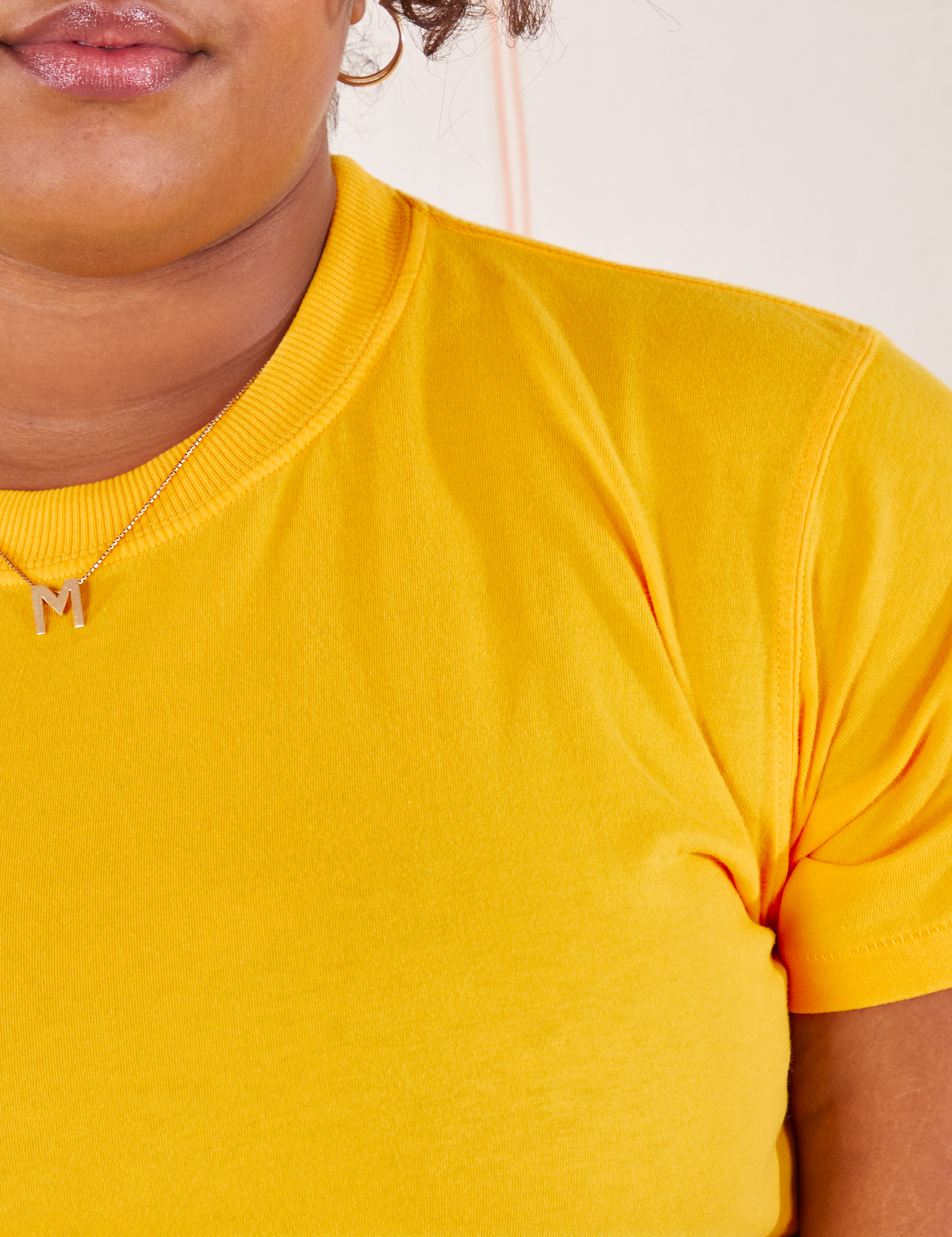 The Organic Vintage Tee in Sunshine Yellow front close up on Morgan