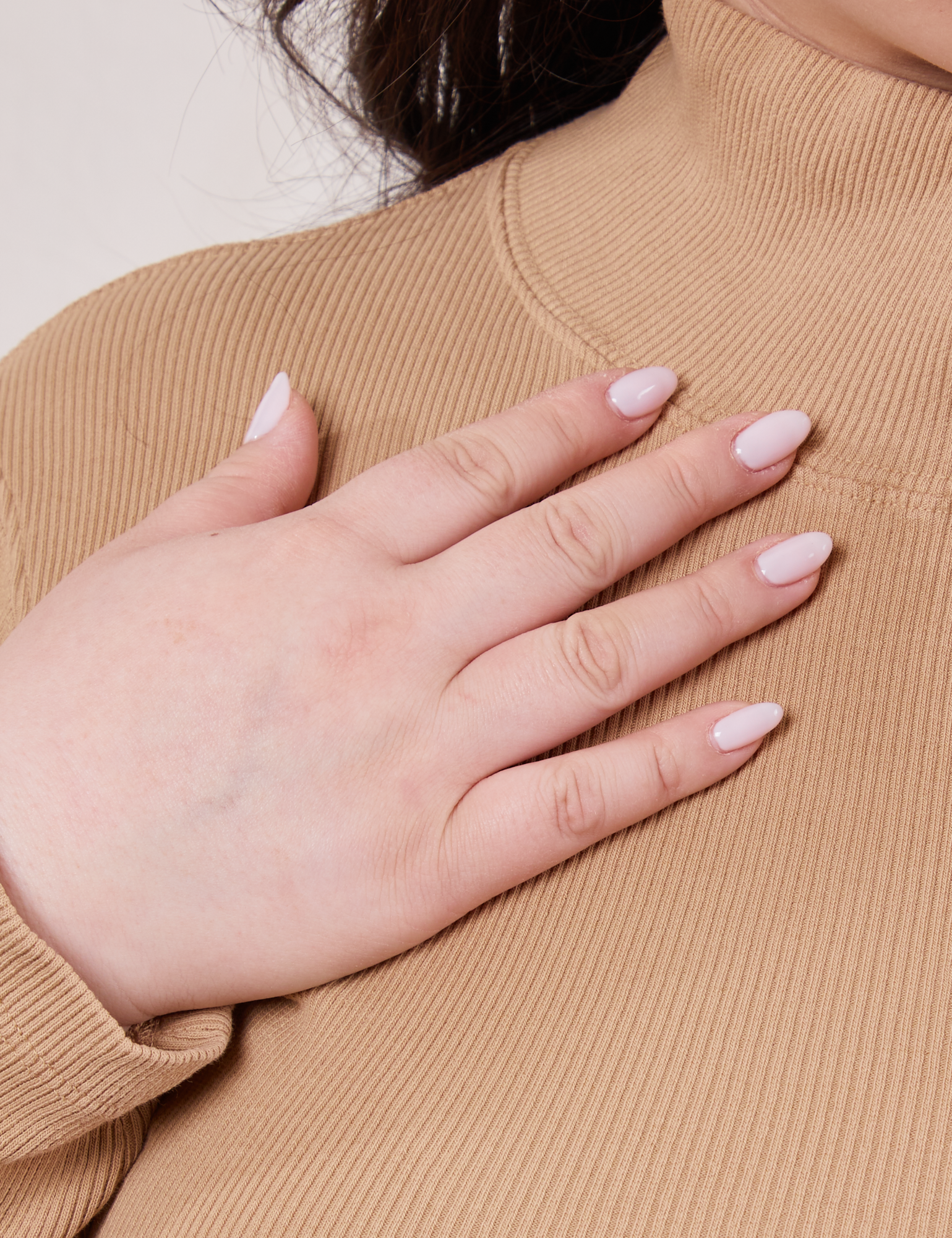 Front close up of Essential Turtleneck in Tan on Ashley