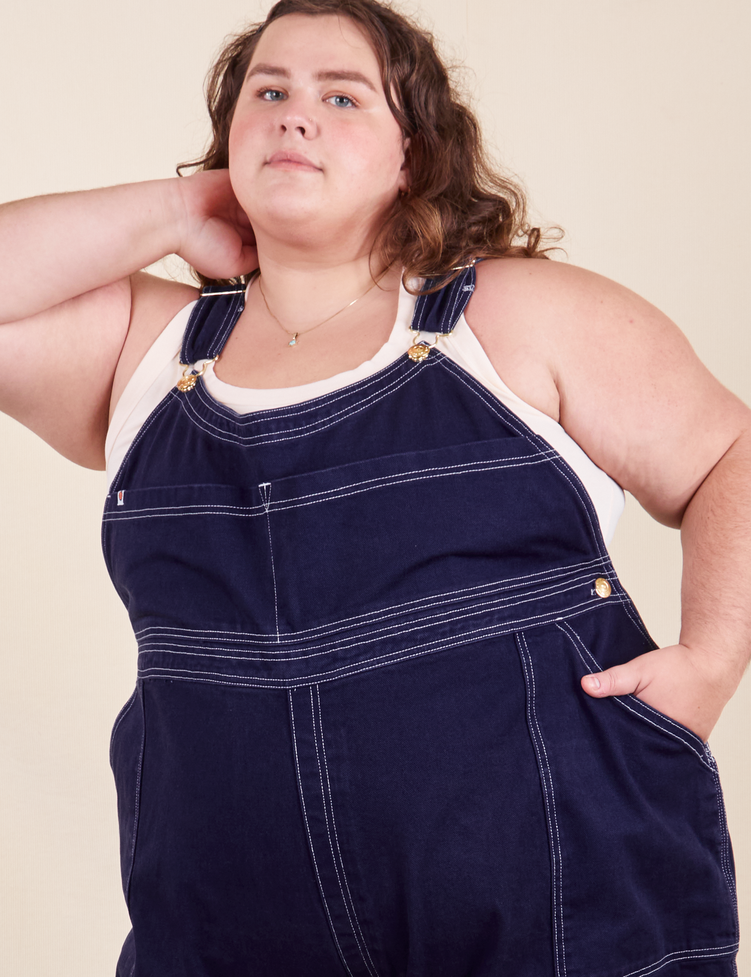 Mara is wearing Original Overalls in Navy Blue and vintage off-white Tank Top