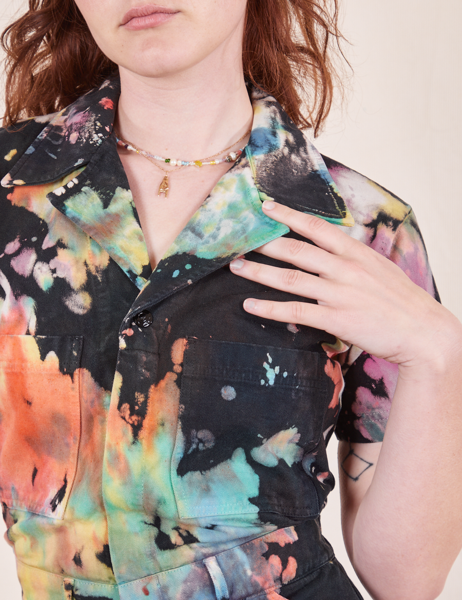 Short Sleeve Jumpsuit in Rainbow Magic Waters font close up on Alex