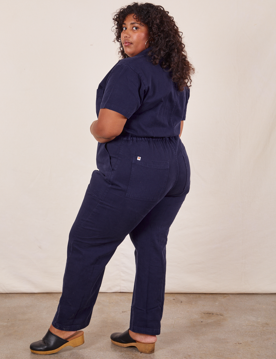 Angled back view of Short Sleeve Jumpsuit in Navy Blue worn by Morgan