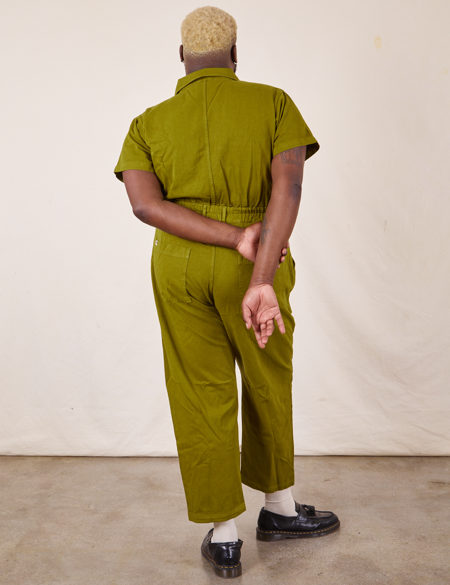 Back view of Short Sleeve Jumpsuit in Olive Green worn by Elijah