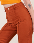 Close up of Western Pants in Burnt Terracotta on Alex