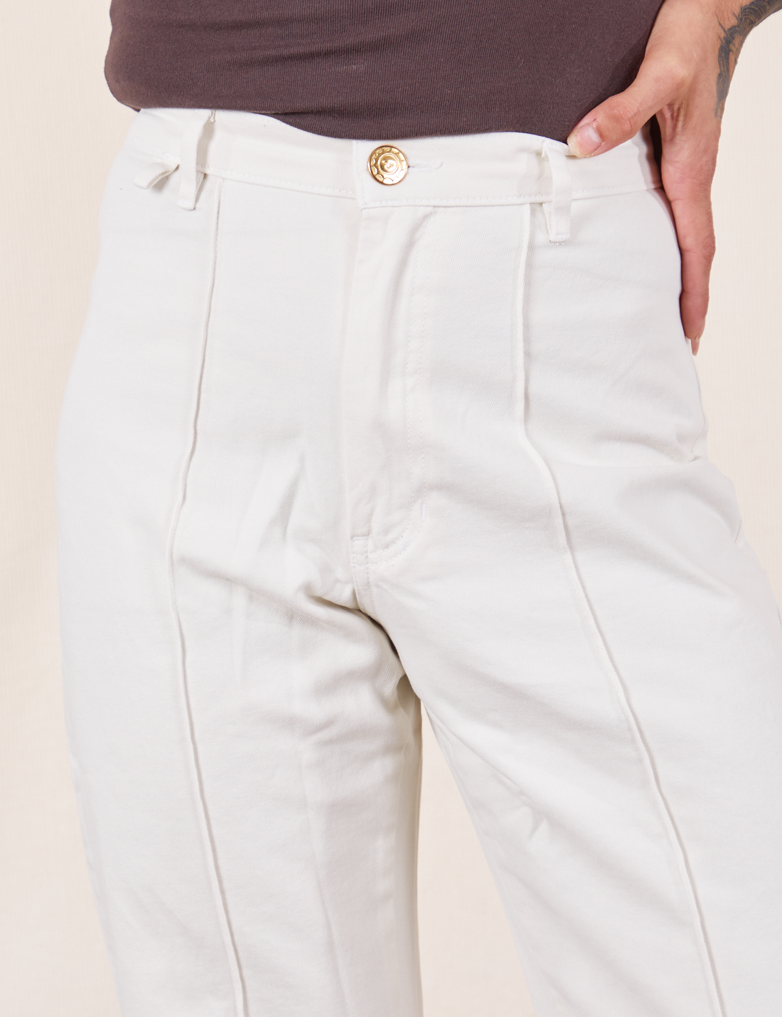 Western Pants in Vintage Tee Off-White front close up on Jesse