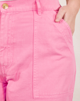 Work Pants in Bubblegum Pink front close up on Faye with hand in pocket
