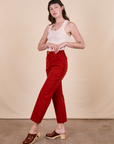 Side view of Work Pants in Paprika on vintage off-white Tank Top on Alex