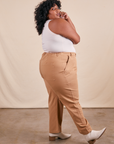 Side view of Work Pants in Tan and vintage off-white Tank Top on Morgan