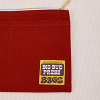 Big Pouch in Paprika with Big Bud Press label in brown and yellow