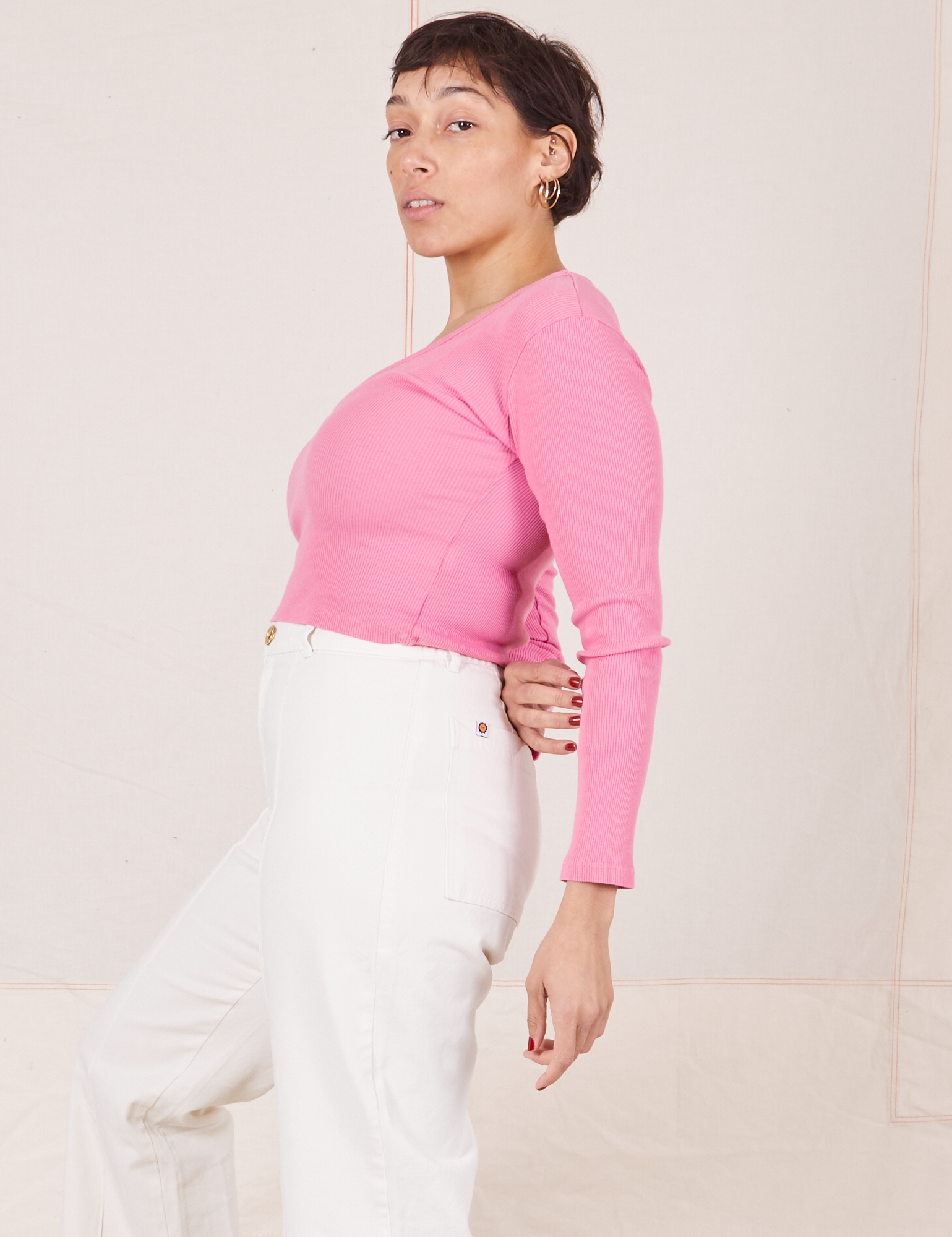 Side view of Long Sleeve V-Neck Tee in Bubblegum Pink worn by Tiara