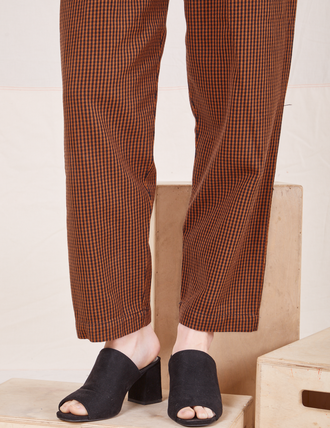 Pant leg close up of Checker Trousers in Brown worn by Alex