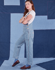 Side view of Indigo Denim Original Overalls in Light Wash worn by Alex