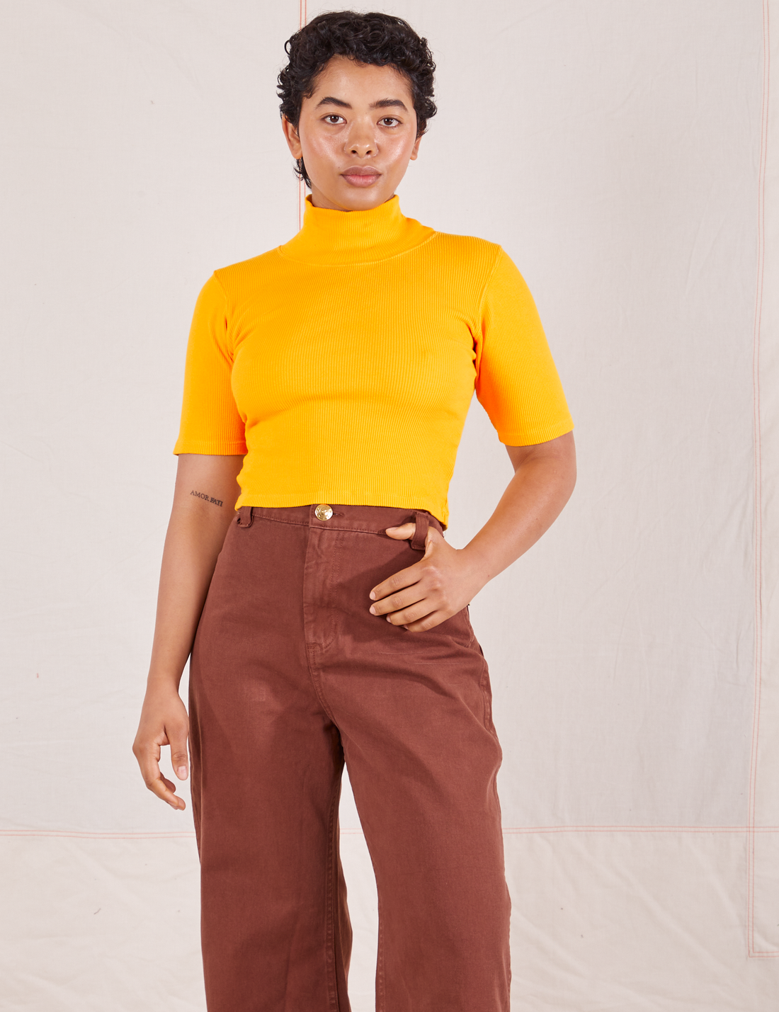 1/2 Sleeve Essential Turtleneck in Sunshine Yellow on Mika wearing fudgesicle brown Bell Bottoms