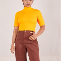 1/2 Sleeve Essential Turtleneck in Sunshine Yellow on Mika wearing fudgesicle brown Bell Bottoms