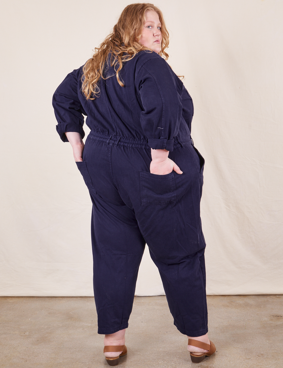 Back view of Everyday Jumpsuit in Navy Blue worn by Catie
