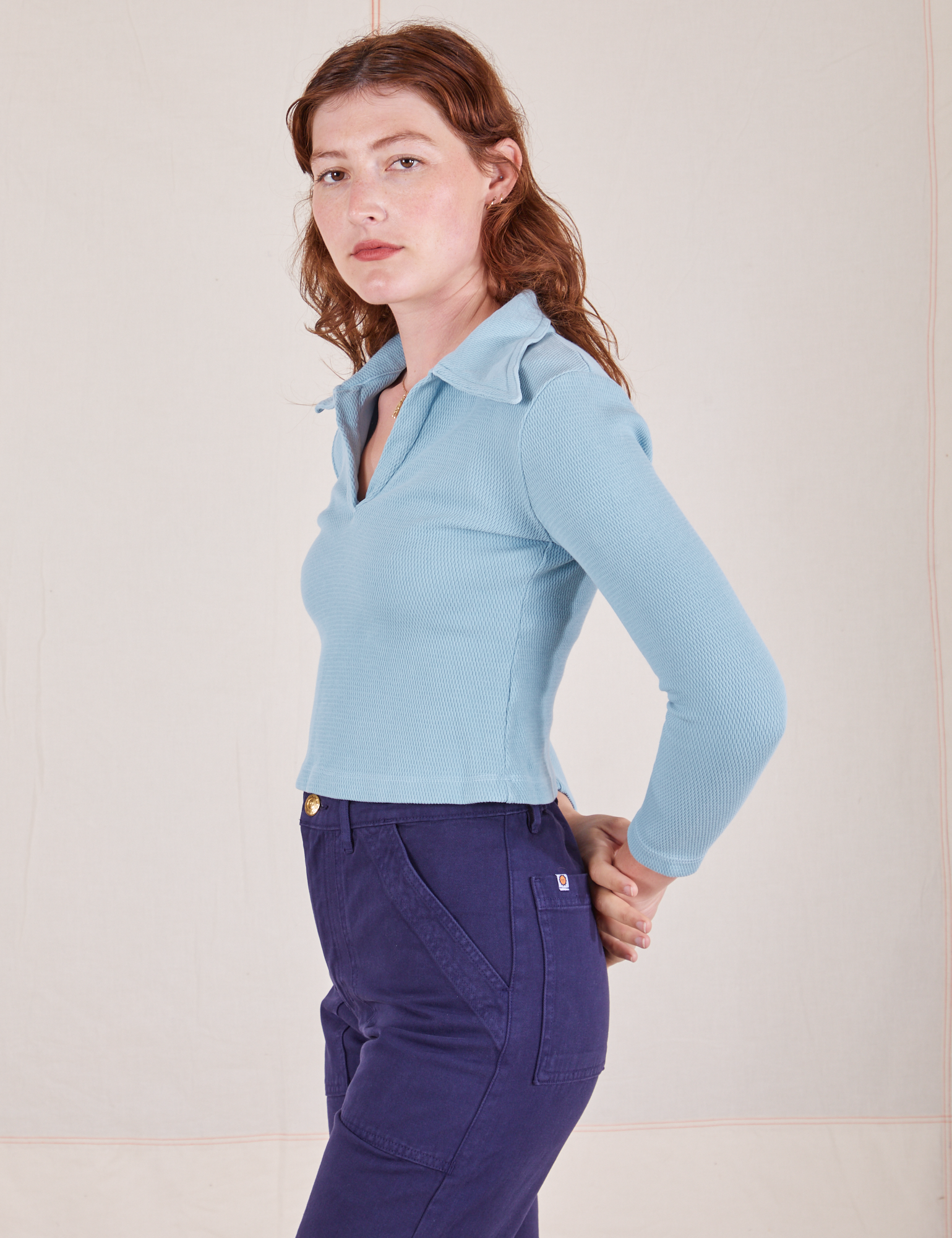 Side view of Long Sleeve Fisherman Polo in Baby Blue worn by Alex
