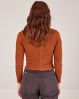 Back view of Long Sleeve Fisherman Polo in Burnt Terracotta worn by Alex