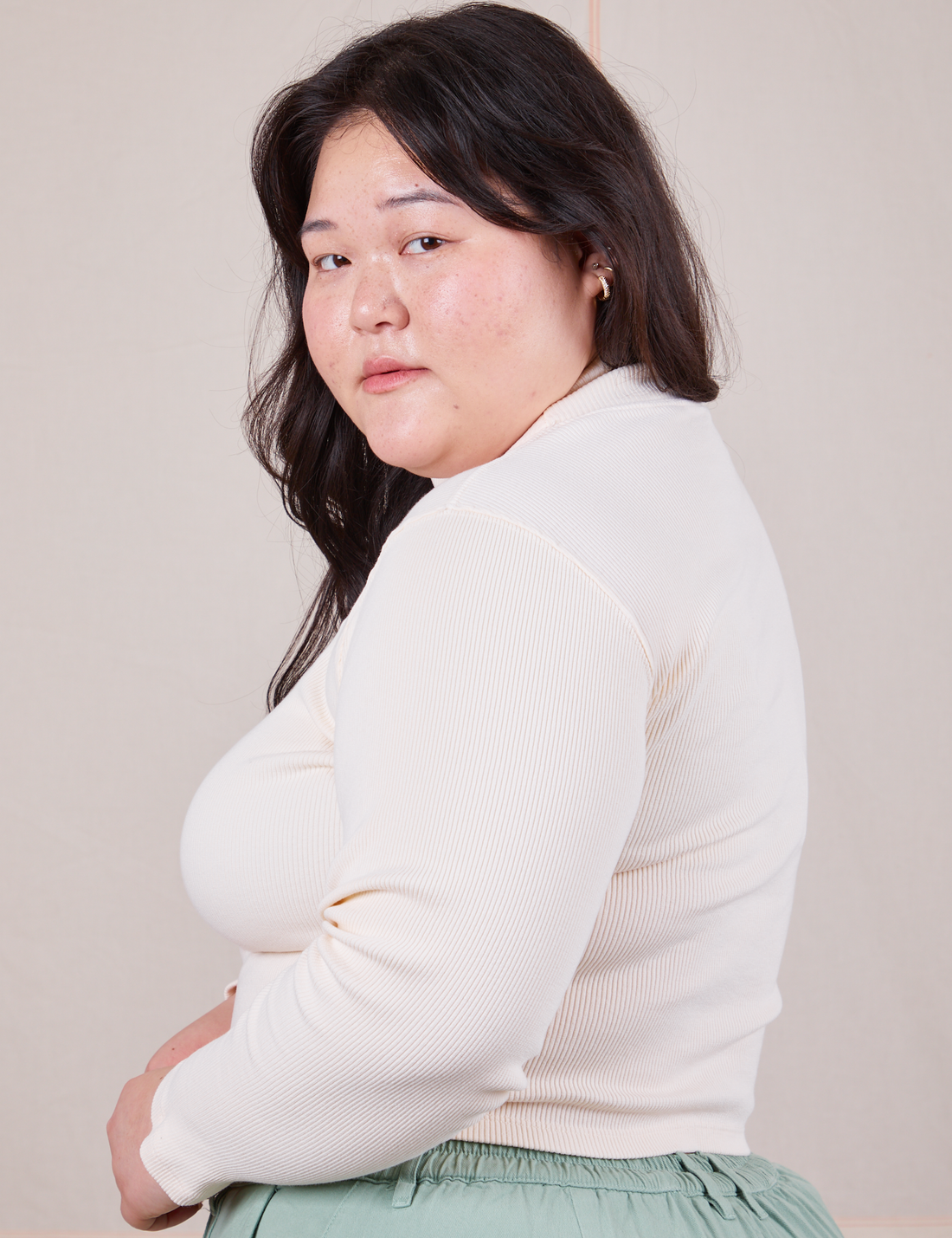 Side view of Essential Turtleneck in Vintage Off-White worn by Ashley