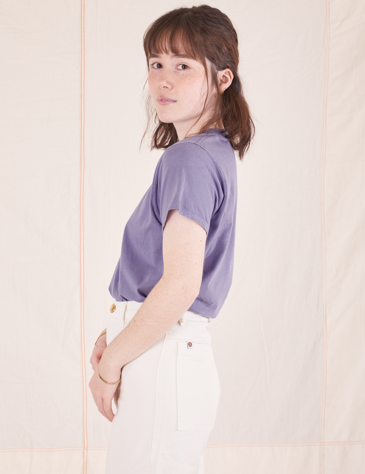 Side view of Organic Vintage Tee in Faded Grape and vintage off-white Western Pants