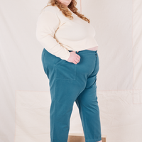 Side view of Organic Work Pants in Marine Blue and vintage off-white Long Sleeve Fisherman Polo on Catie