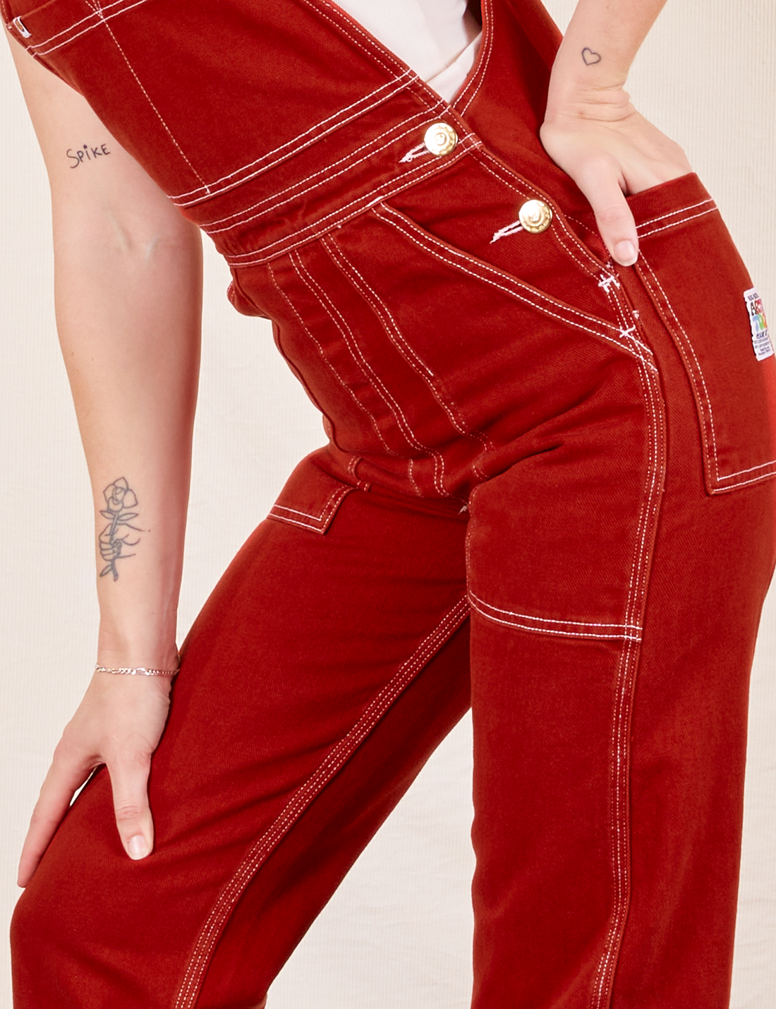 Side view close up of Original Overalls in Paprika worn by Alex
