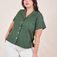 Faye is wearing Pantry Button-Up in Dark Emerald Green