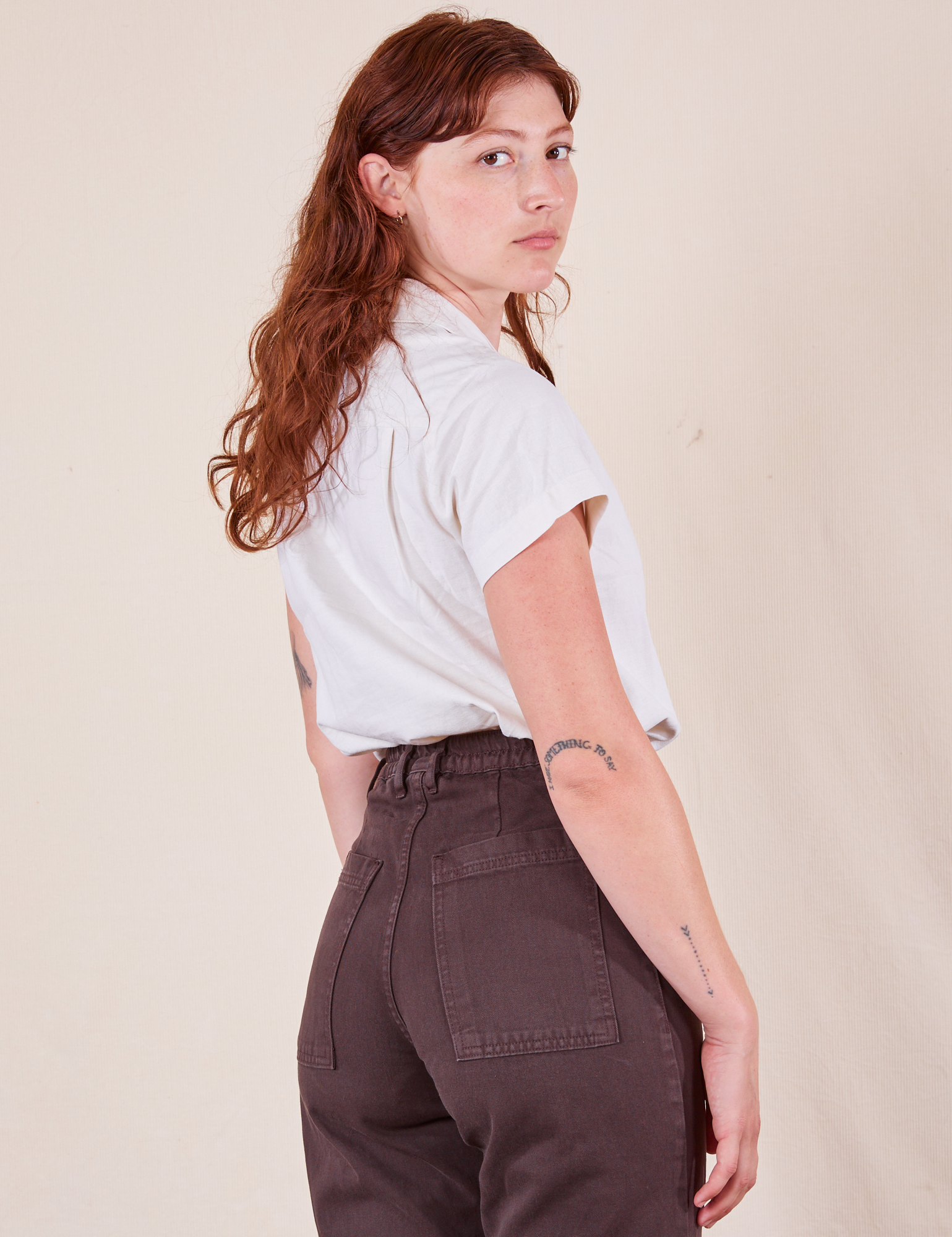 Angled back view of Pantry Button-Up in Vintage Tee White and espresso brown Western Pants 