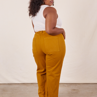 Western Pants in Spicy Mustard back view on Morgan wearing vintage off-white Tank Top