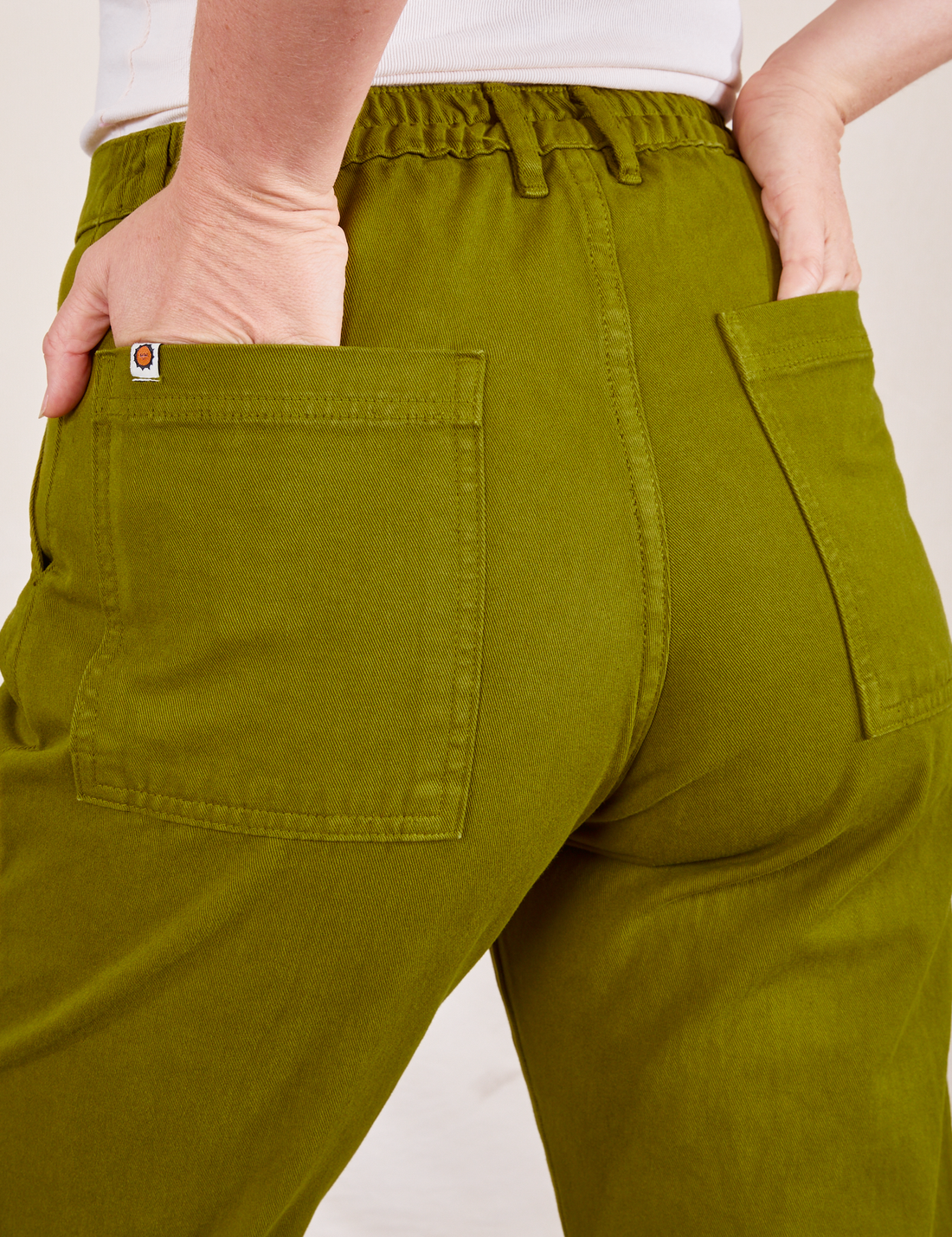 Work Pants in Olive Green back view close up on Allison