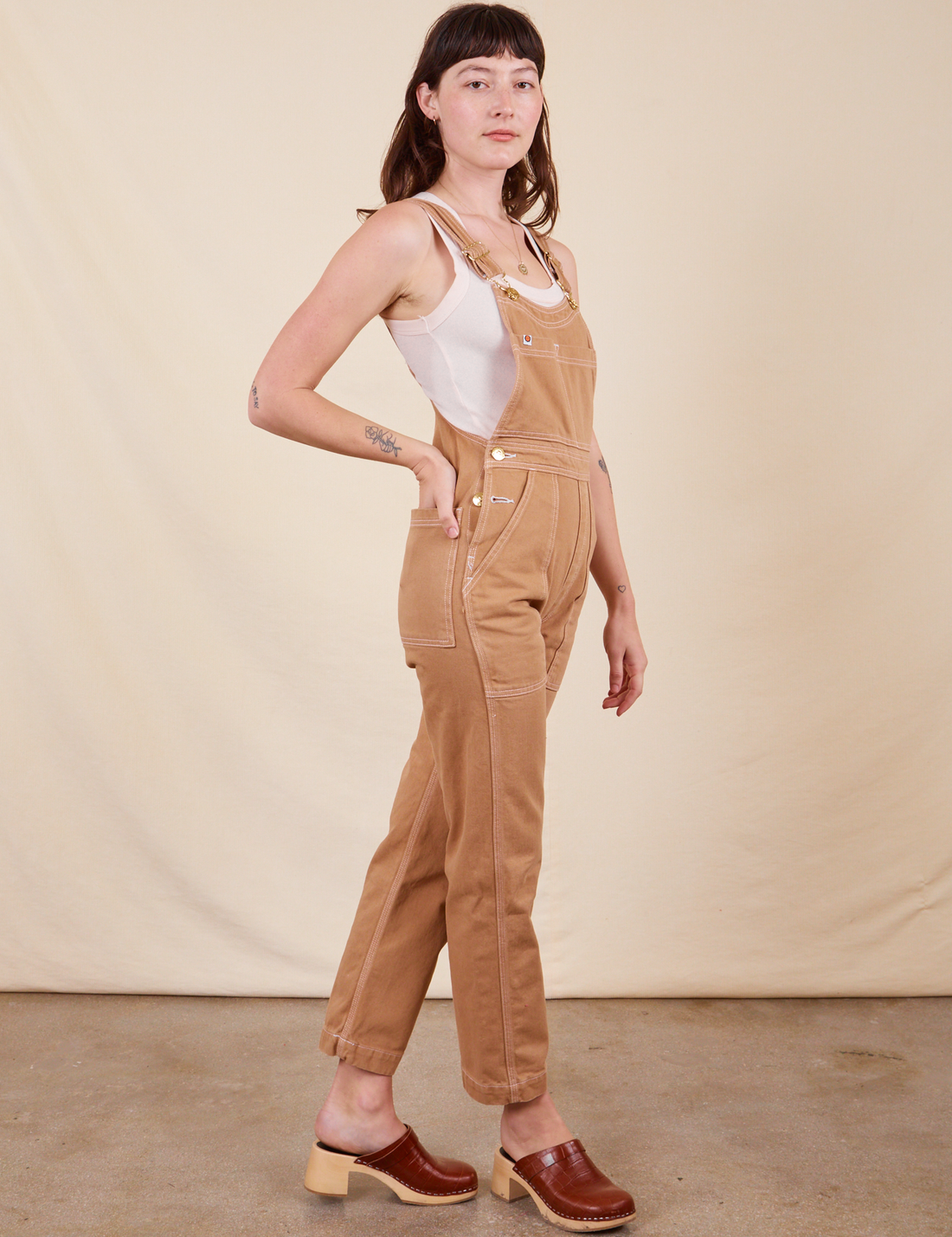 Side view of Original Overalls in Tan worn by Alex