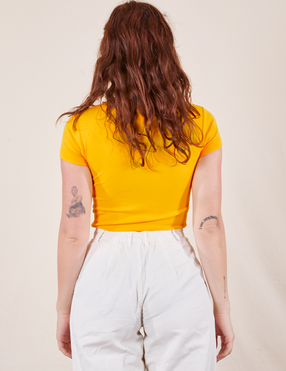 Back view of Baby Tee in Sunshine Yellow on Alex