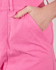 Short Sleeve Jumpsuit in Bubblegum Pink front pocket close up. Worn by Allison with hand in pocket.