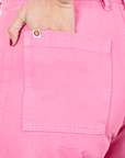 Western Pants in Bubblegum Pink back pocket close up. Worn by Tiara with hand in pocket
