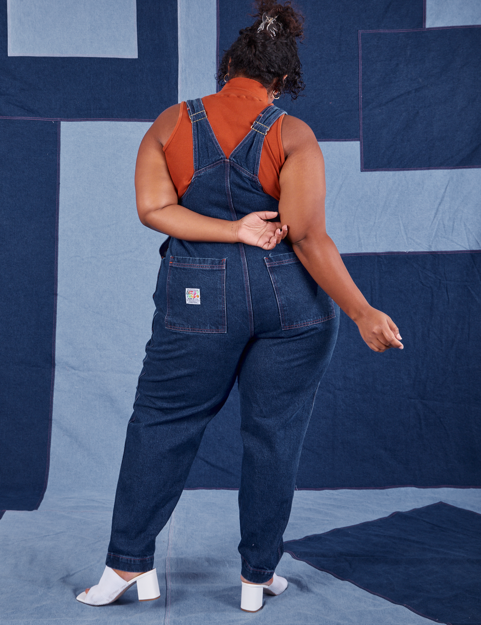 Back view of Indigo Denim Original Overalls in Dark Wash worn by Morgan