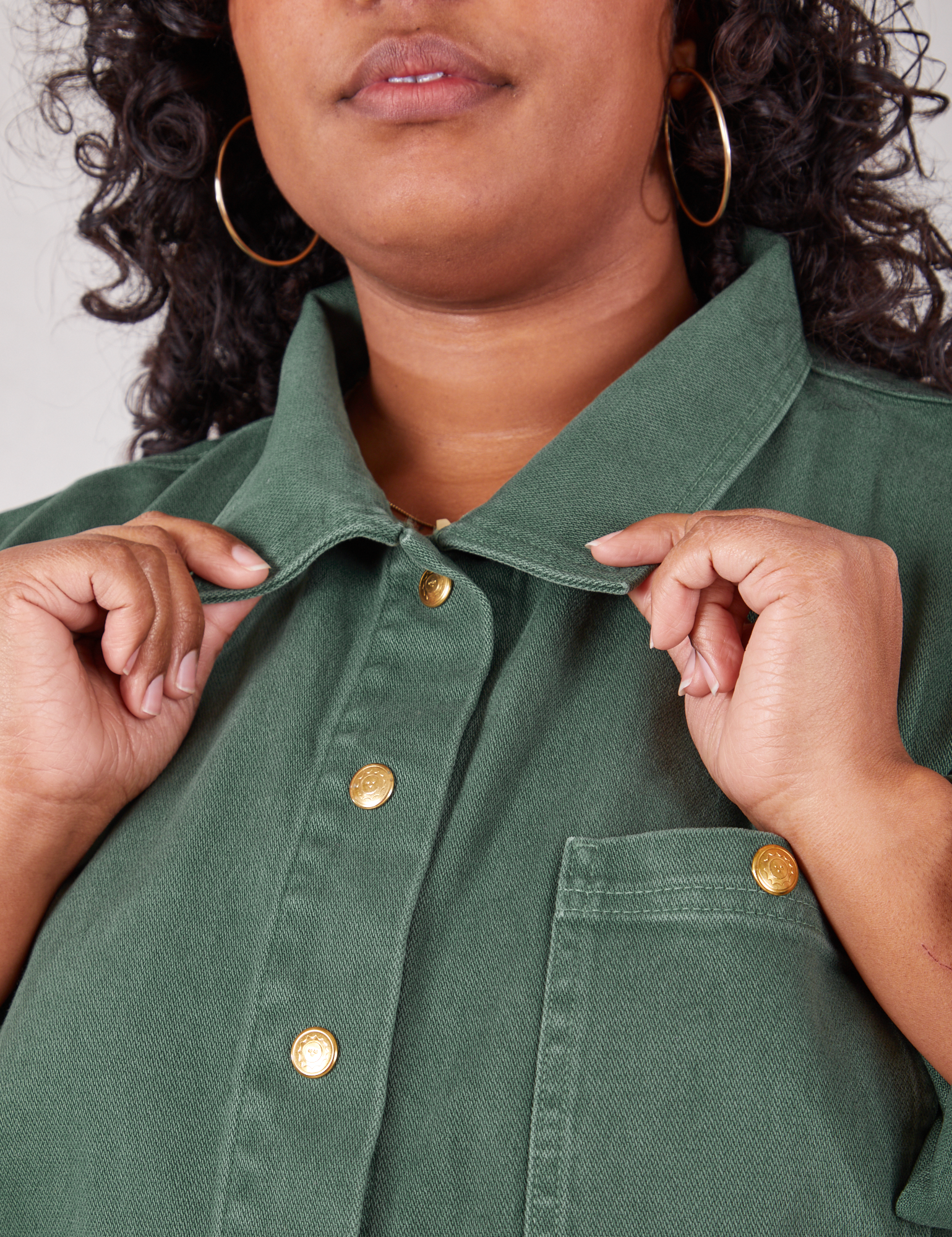 Denim Work Jacket in Dark Emerald Green front close up on Morgan holding collar