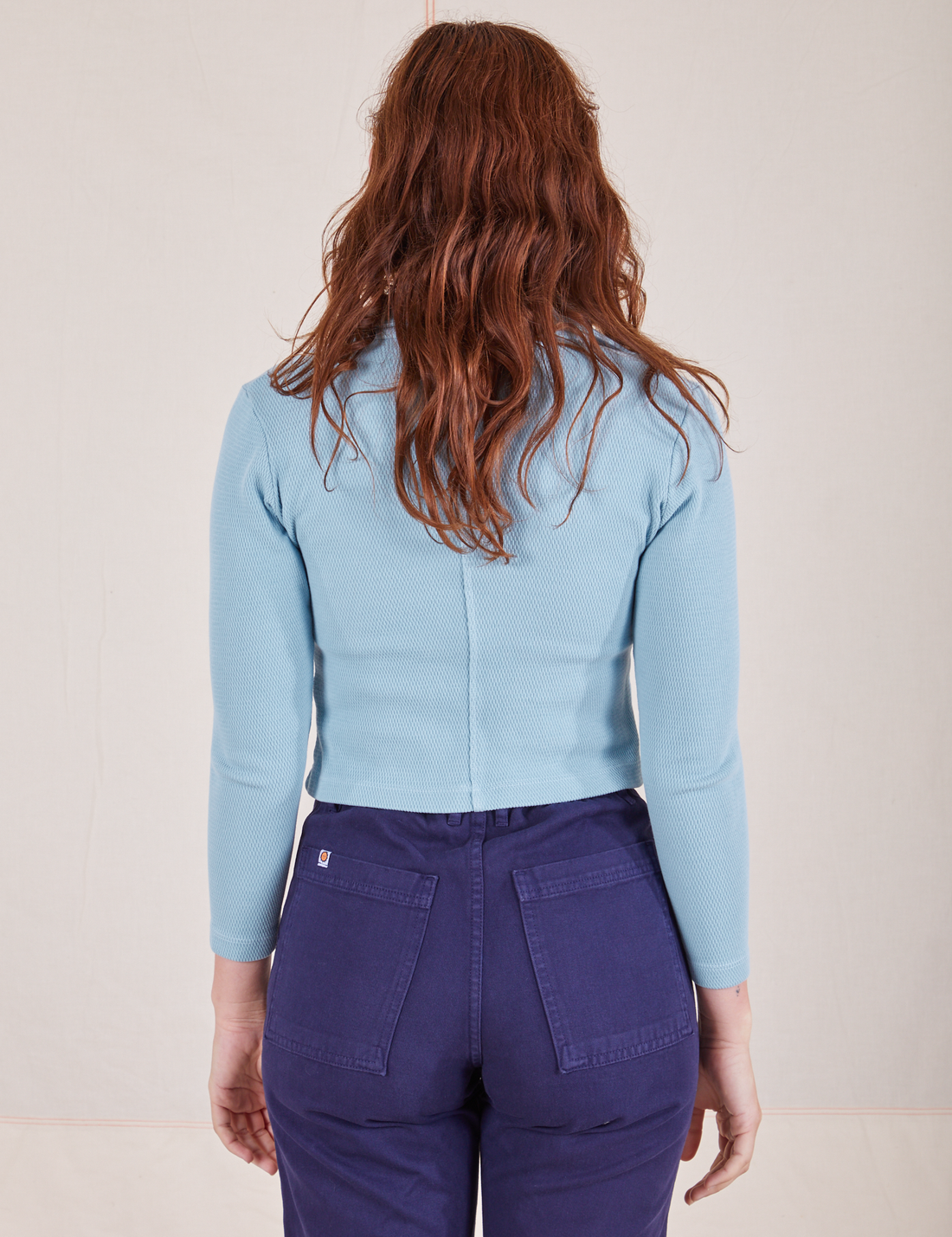 Long Sleeve Fisherman Polo in Baby Blue back view on Alex wearing navy blue Work Pants