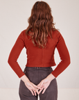 Back view of Long Sleeve Fisherman Polo in Paprika worn by Alex