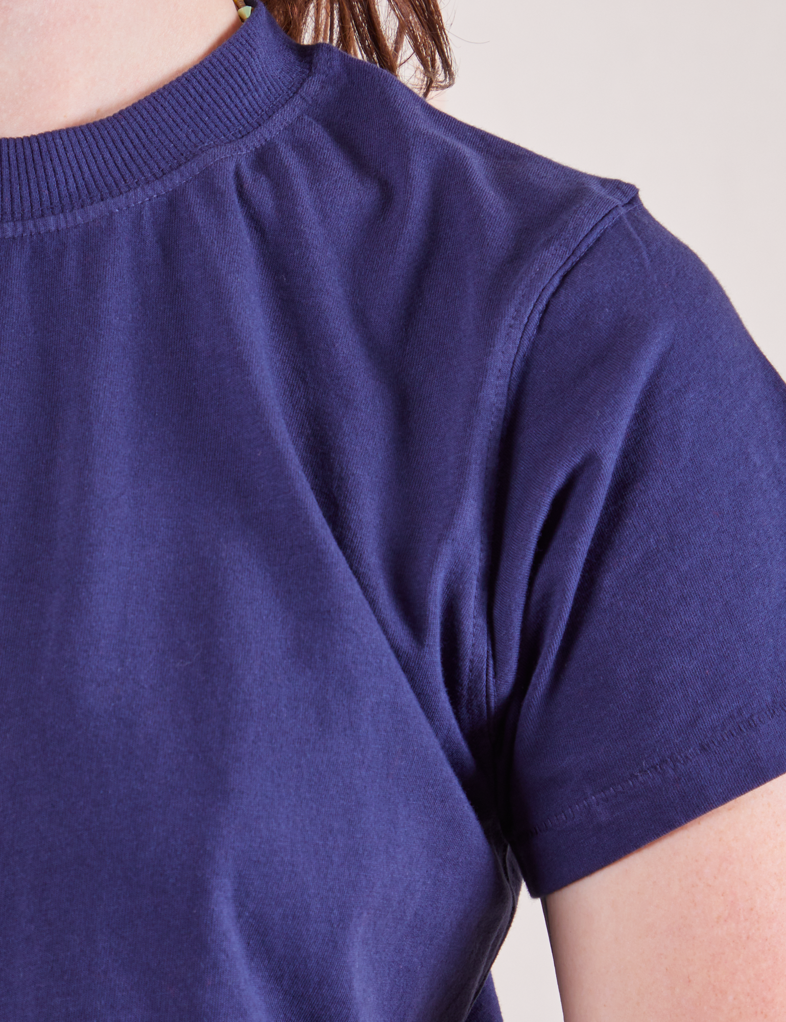The Organic Vintage Tee in Navy Blue front close up on Alex