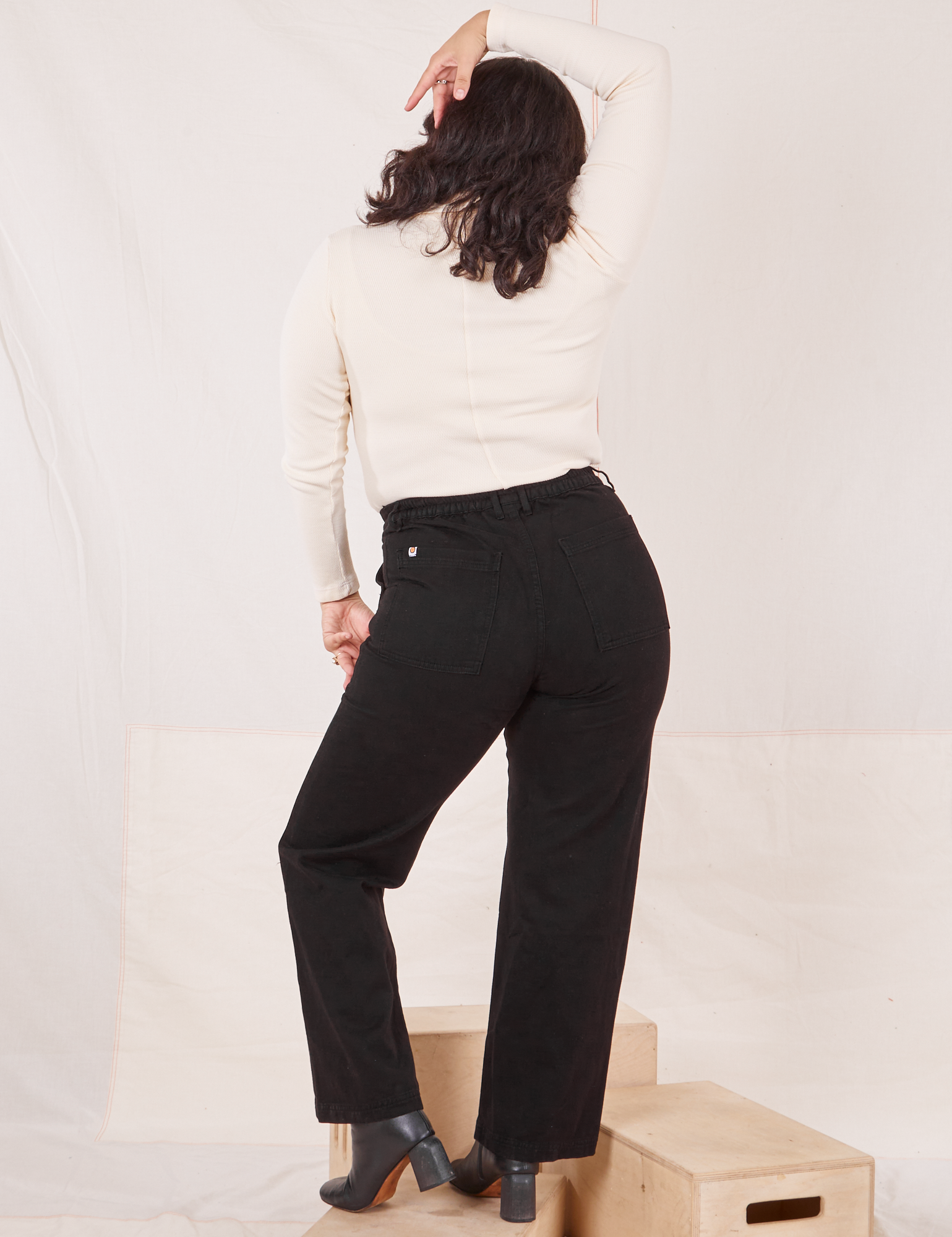 Back view of Organic Work Pants in Basic Black worn by Melanie
