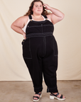 Mara is 5'5" and wearing 4XL Original Overalls in Basic Black